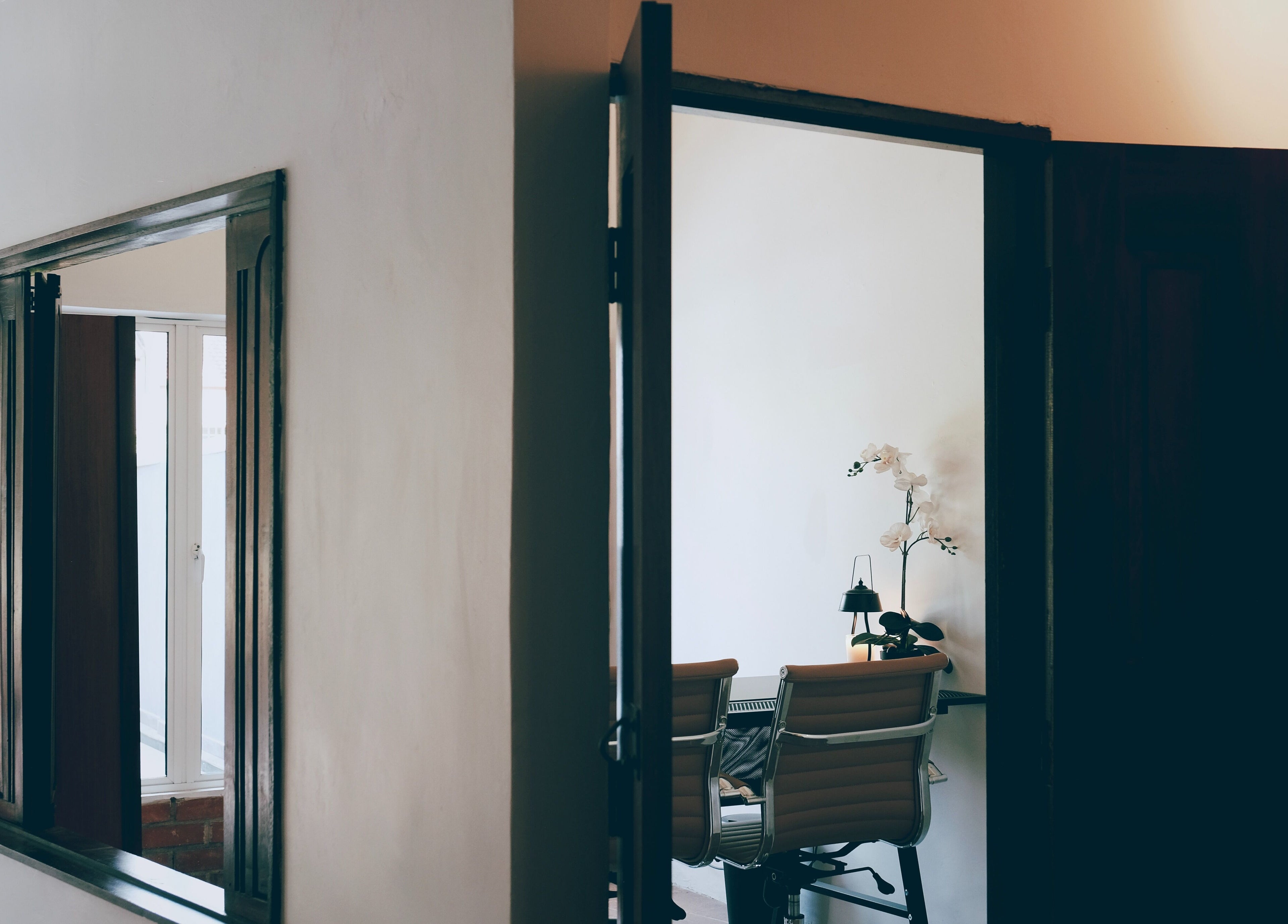 Elegant office room at Sage Centre, Subang Jaya, Selangor, MY with chairs and orchids.