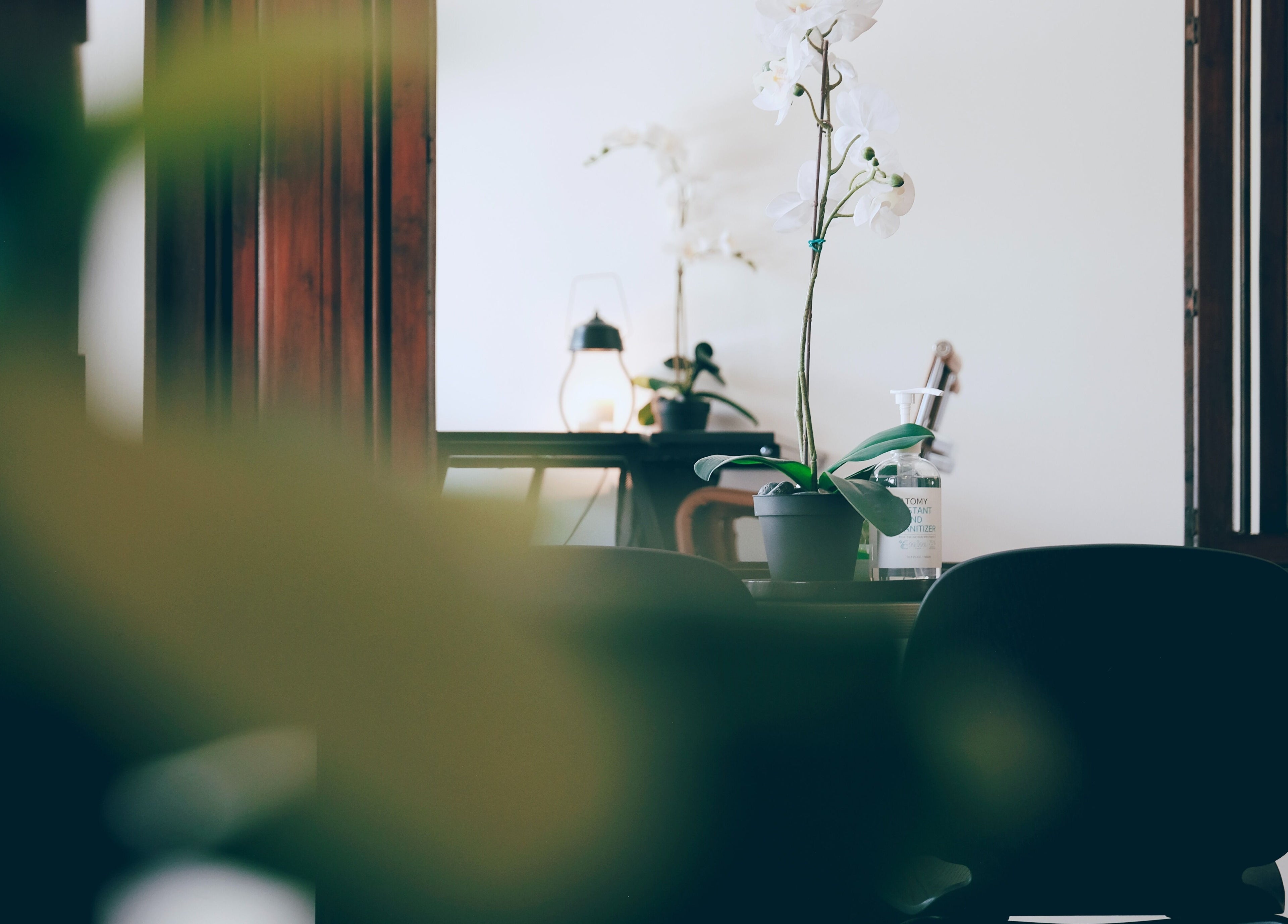 Calming corner at Sage Centre, Subang Jaya, Selangor, MY, featuring an elegant orchid and soft lighting.