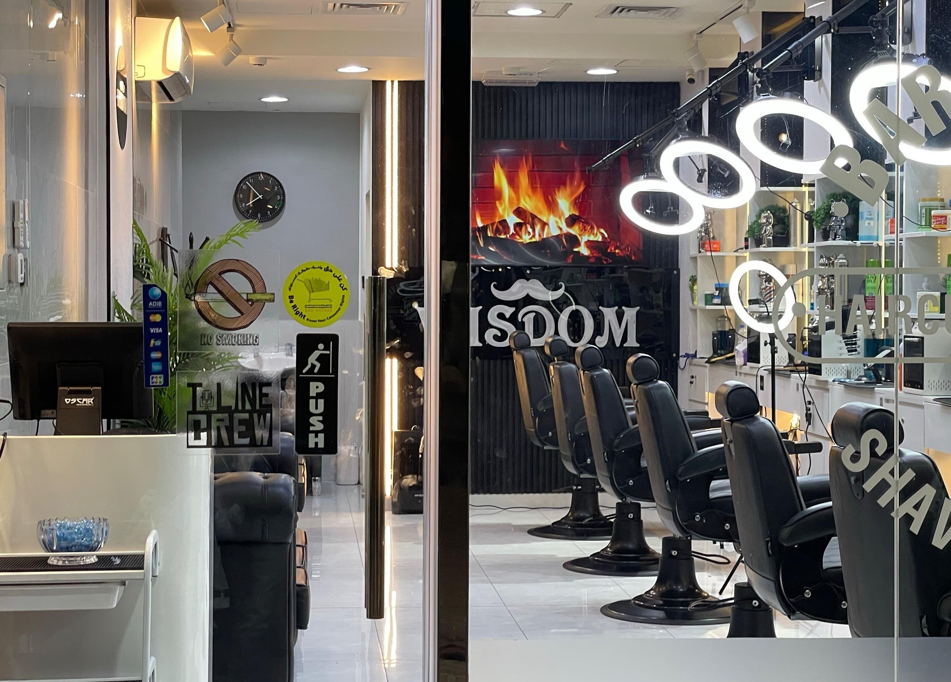 Modern interior of Wisdom Gents Saloon in Dubai, AE with sleek barber chairs and stylish decor.