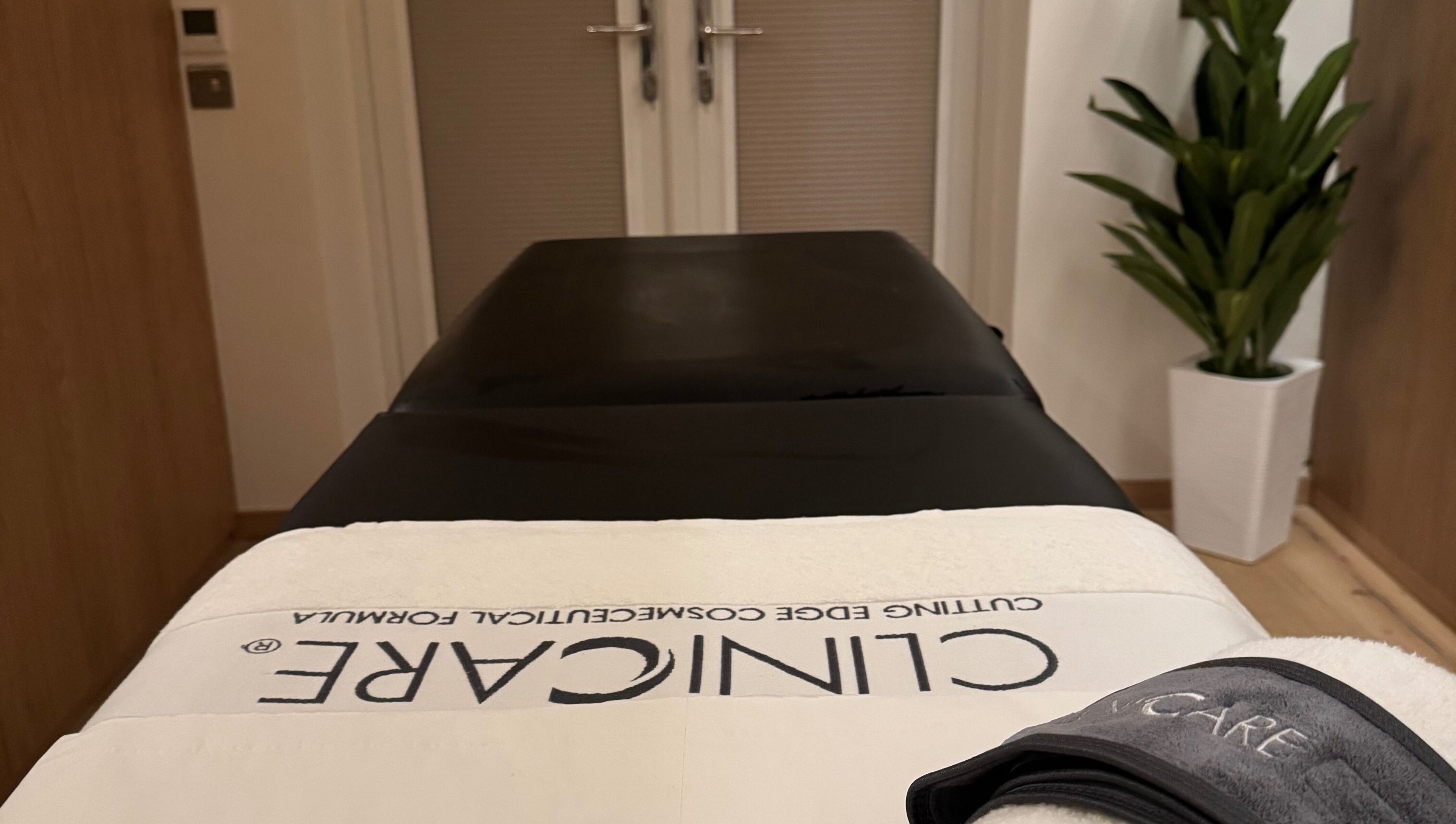 Tranquil treatment room at Definir, Galston, Scotland, GB, featuring a cozy massage table and calming decor.