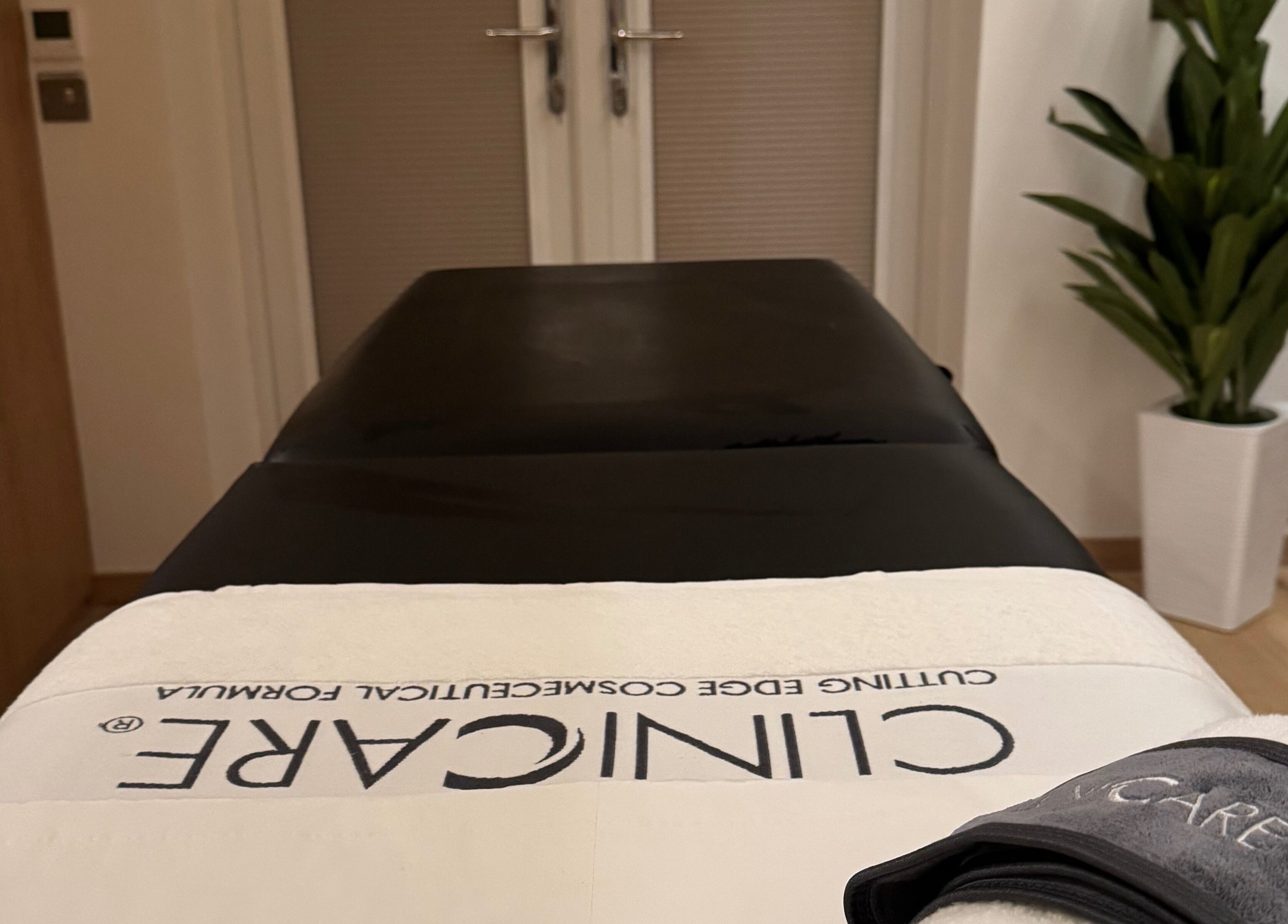 Tranquil treatment room at Definir, Galston, Scotland, GB, featuring a cozy massage table and calming decor.