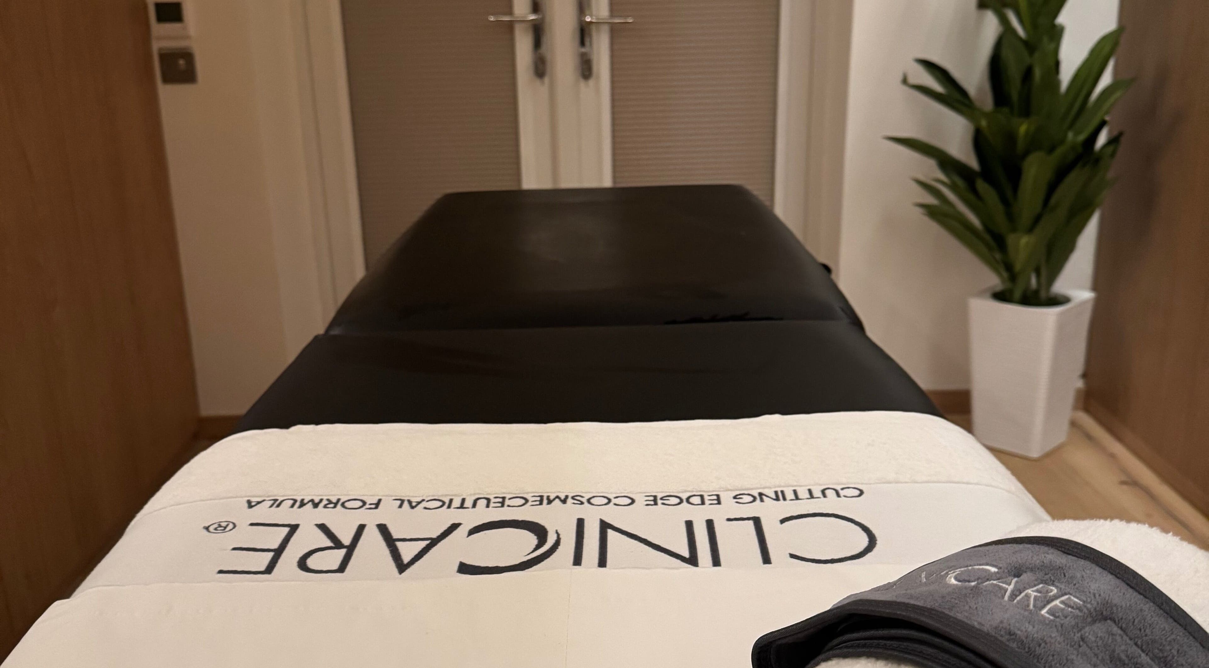 Tranquil treatment room at Definir, Galston, Scotland, GB, featuring a cozy massage table and calming decor.