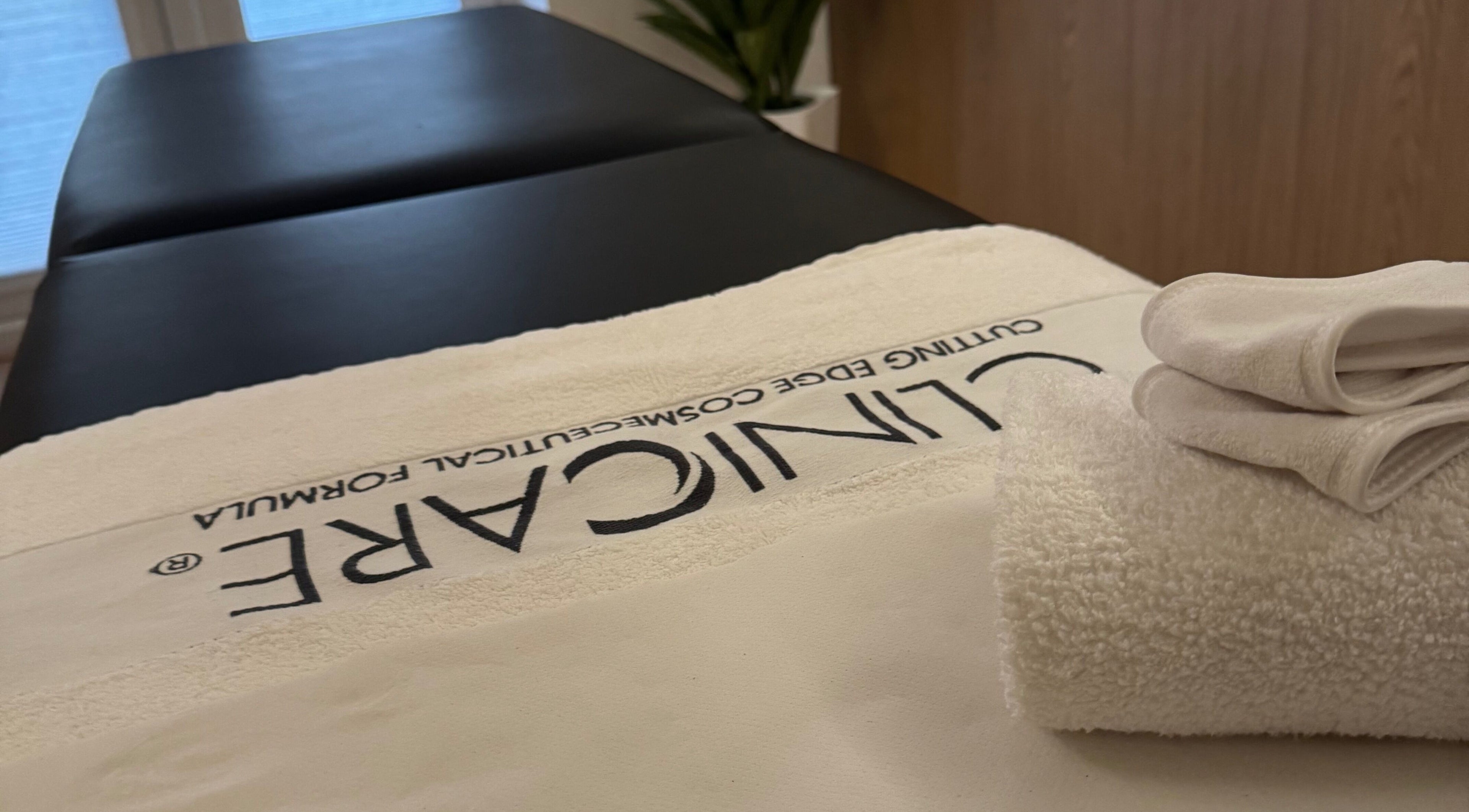 A spa treatment table with fresh towels at Definir, Galston, Scotland, GB.