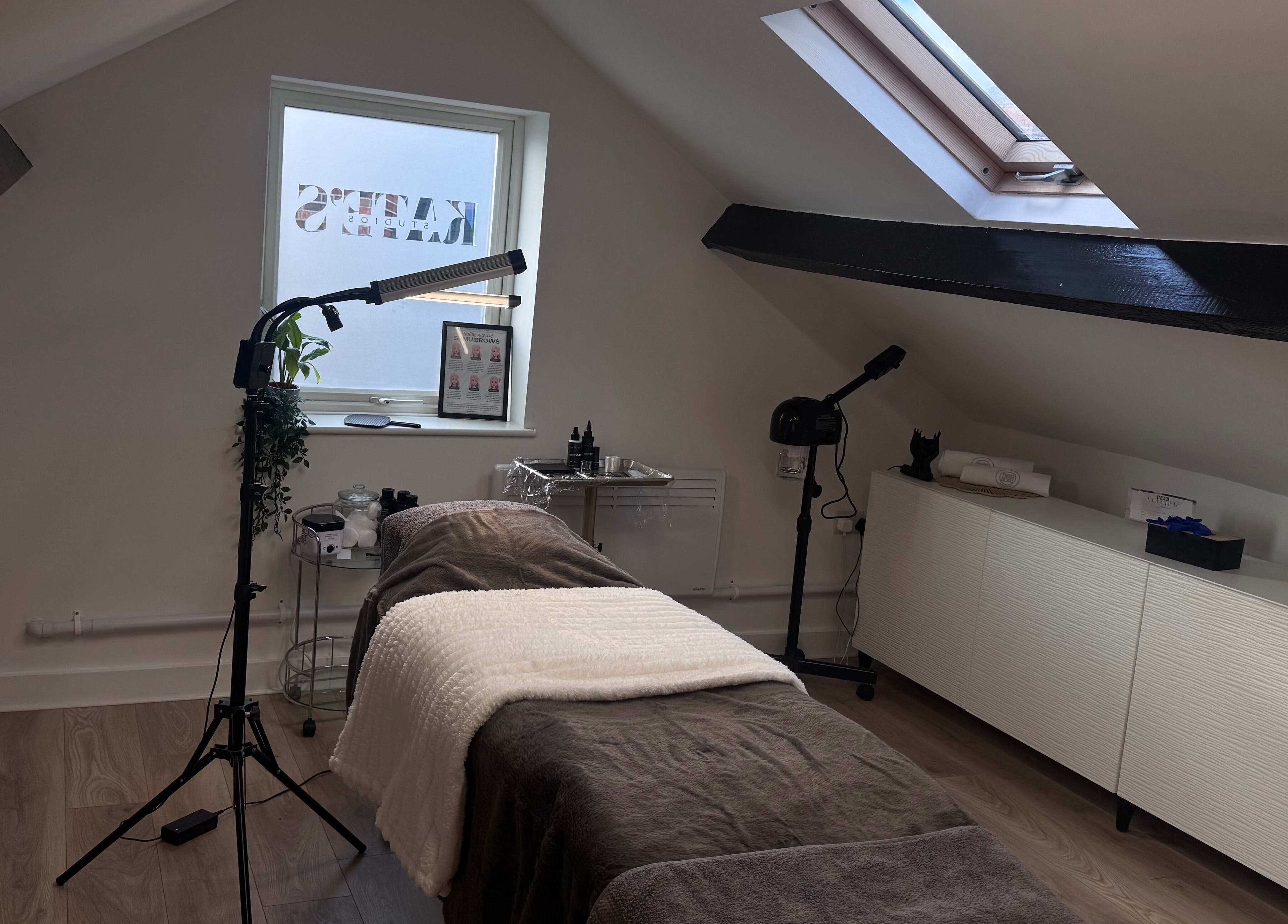 Cozy treatment room at Kate's Studio in Coalville, England, GB with aesthetic decor and wellness equipment.