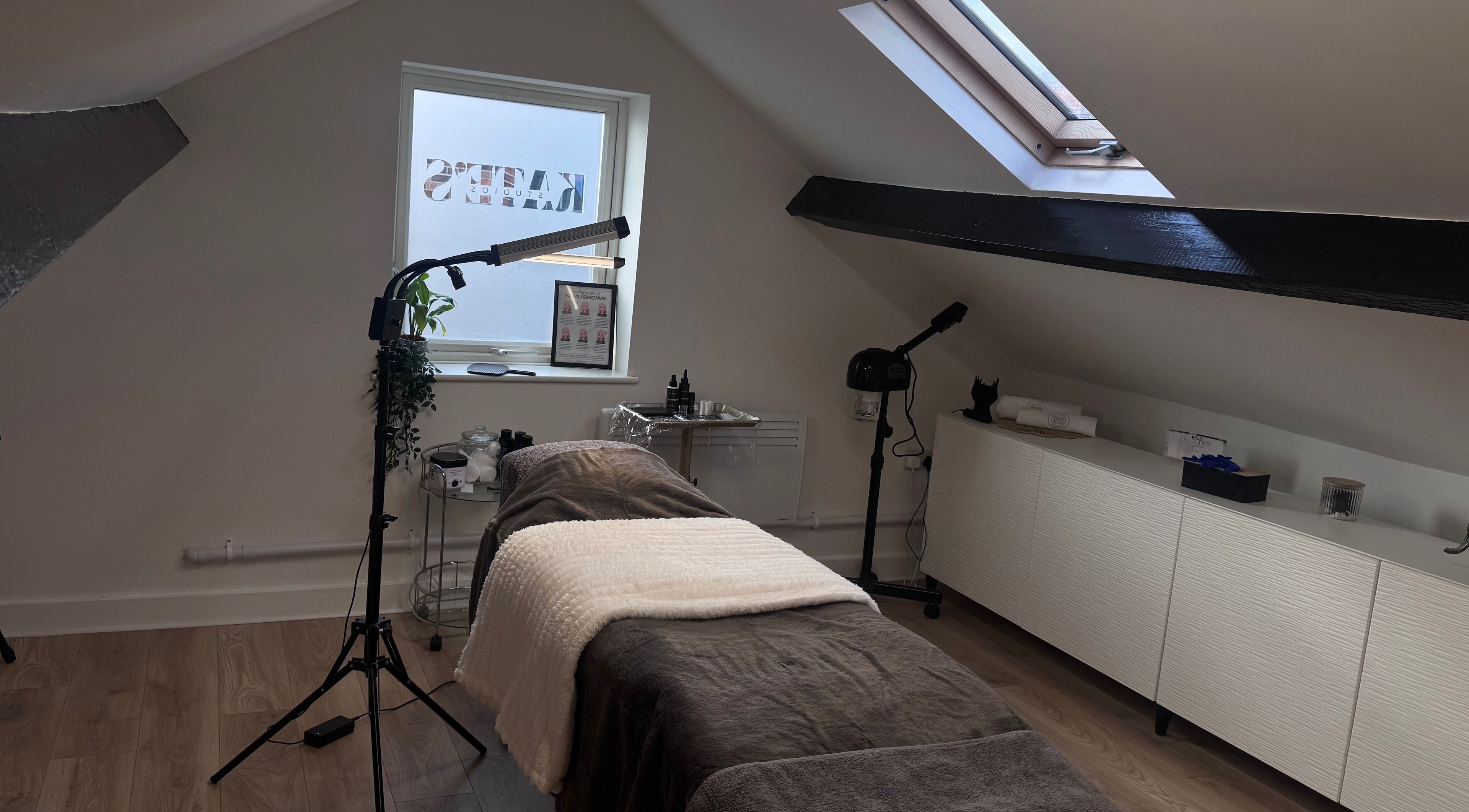 Cozy treatment room at Kate's Studio in Coalville, England, GB with aesthetic decor and wellness equipment.