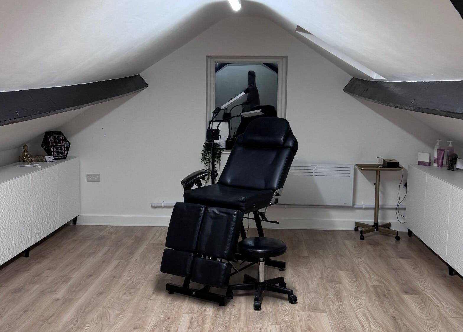 Elegant treatment chair at Kate's Studio, Coalville, England, GB in a bright, modern loft space.