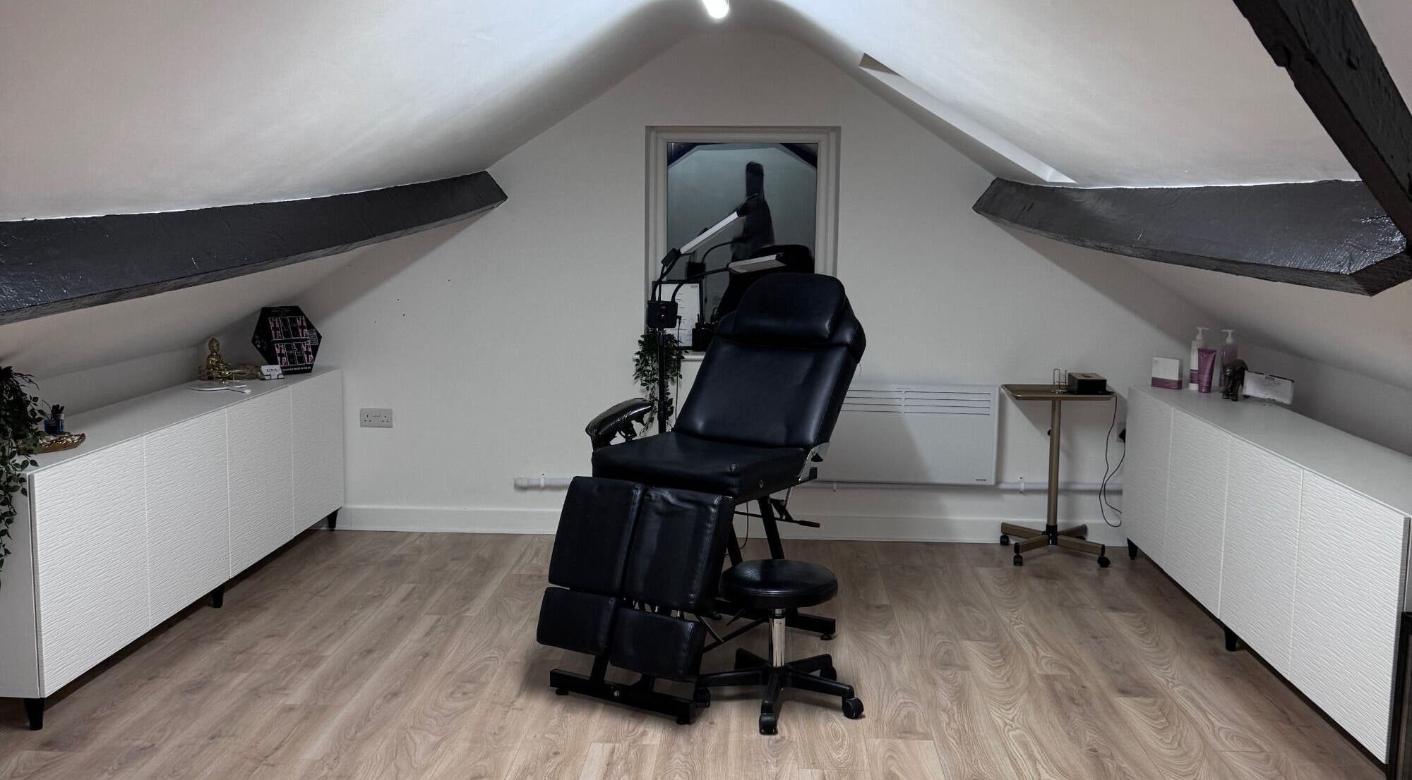 Elegant treatment chair at Kate's Studio, Coalville, England, GB in a bright, modern loft space.