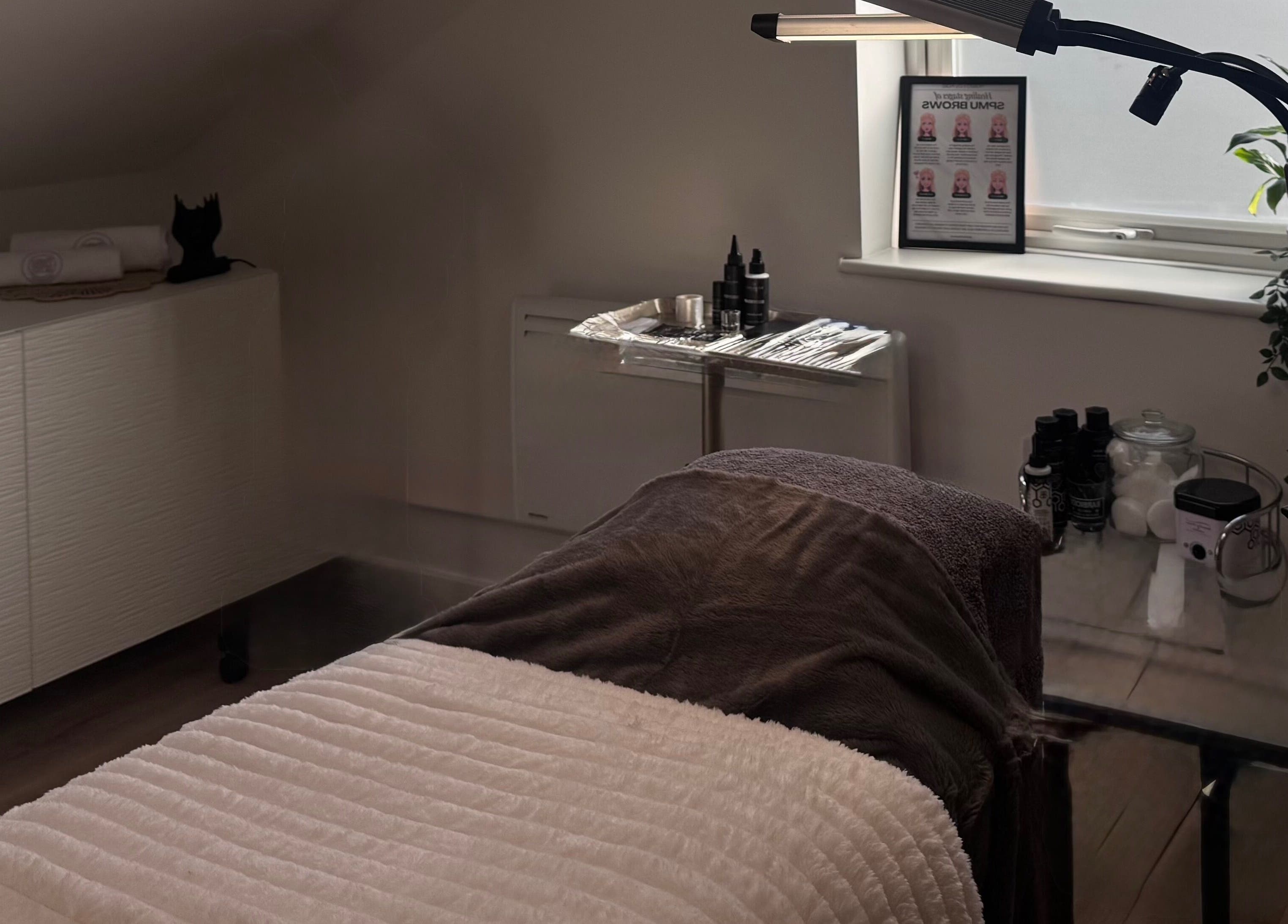 Relaxing spa treatment room at Kate's Studio, Coalville, England, GB featuring a plush bed and modern decor.