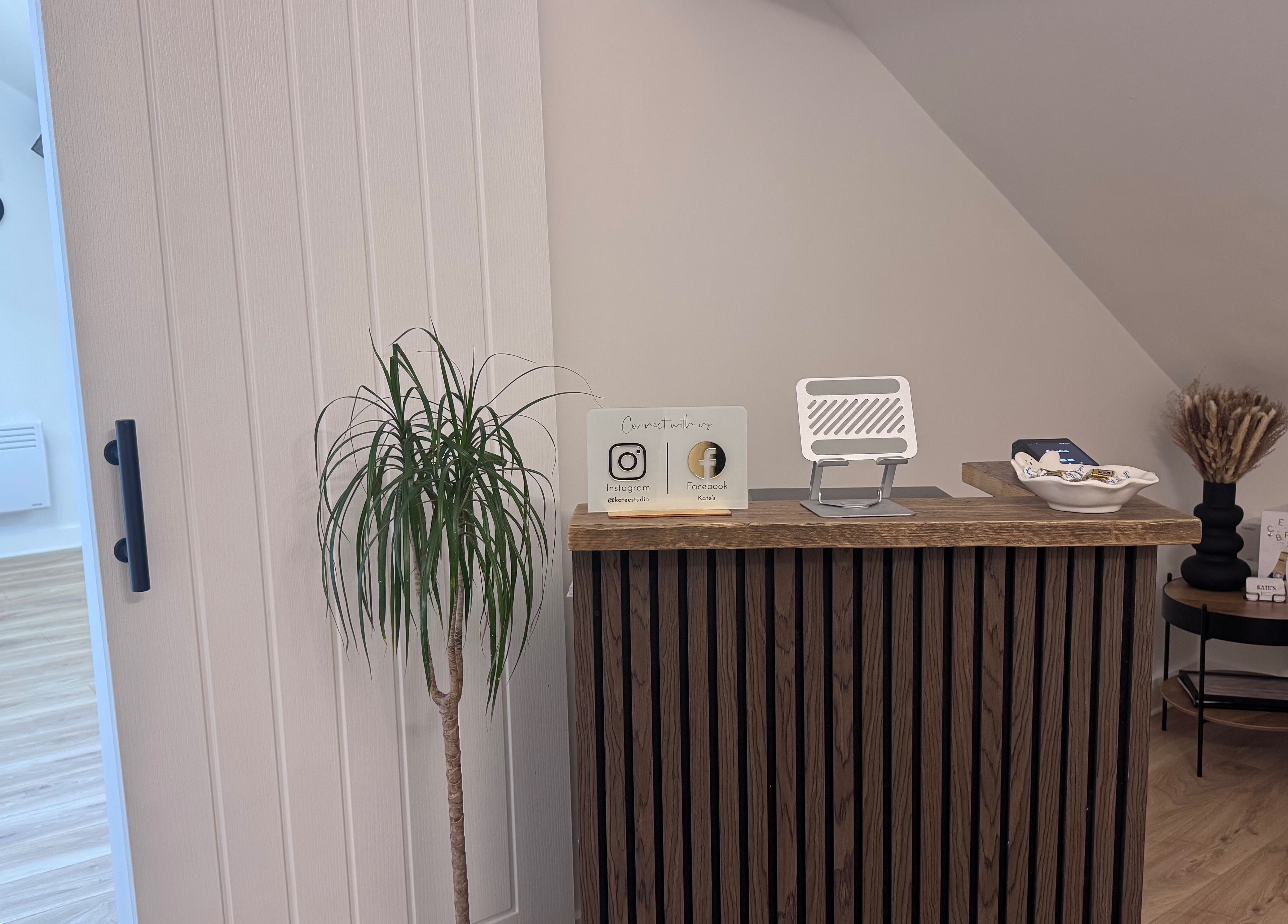 Elegant reception at Kate's Studio, Coalville, England, GB, featuring a modern desk and decor.