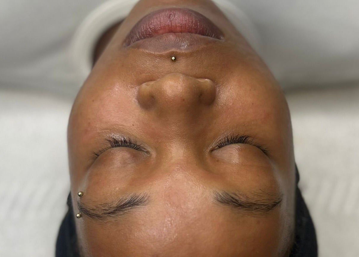 Client enjoying a relaxing facial at AMORE Aesthetics, London, England, GB.