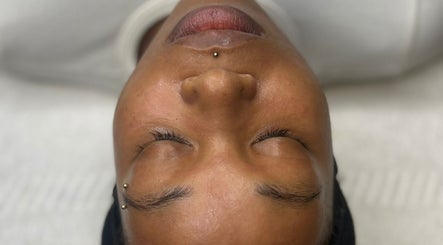 Client enjoying a relaxing facial at AMORE Aesthetics, London, England, GB.
