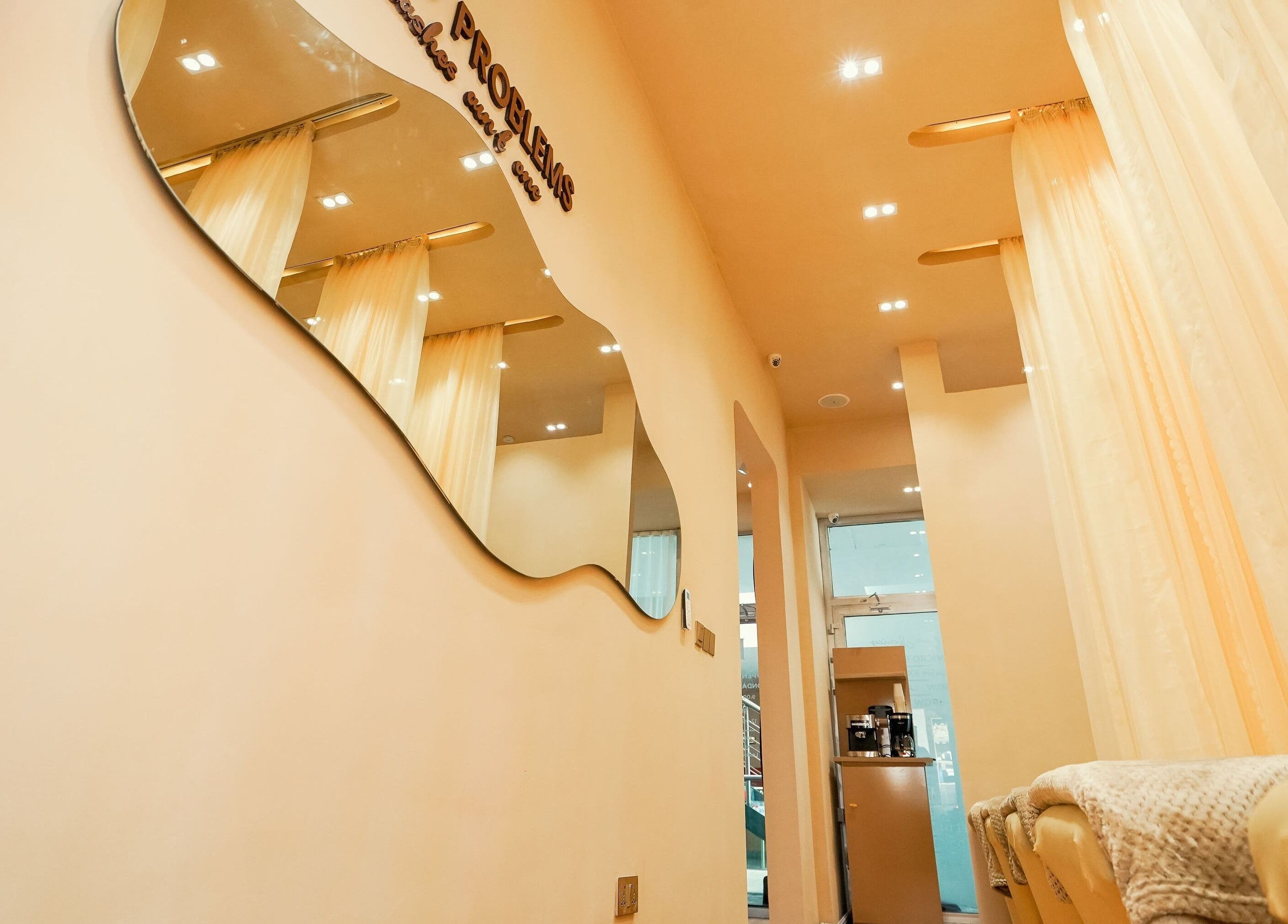 Chic interior of Lash Room with soft lighting and elegant mirrors in Lagos, Lagos, NG.