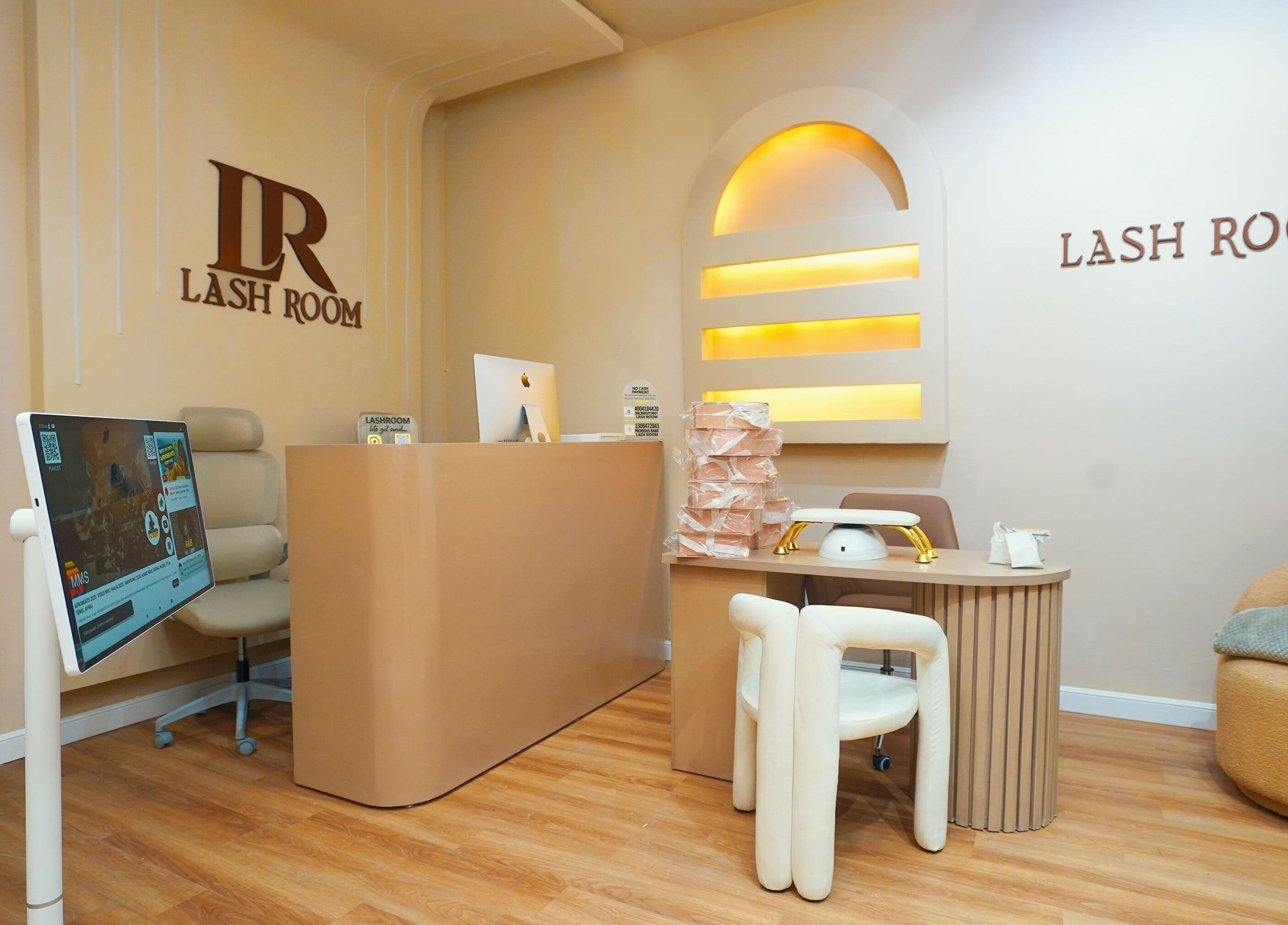 Elegant interior of Lash Room in Lagos, Lagos, NG, showcasing a modern reception area with subtle lighting.