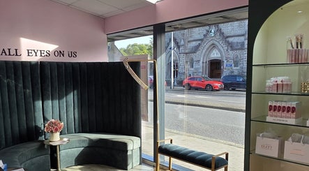 Chic interior of Elzyt Brows by Patricija in Drogheda, County Louth, IE, featuring elegant seating and product display.