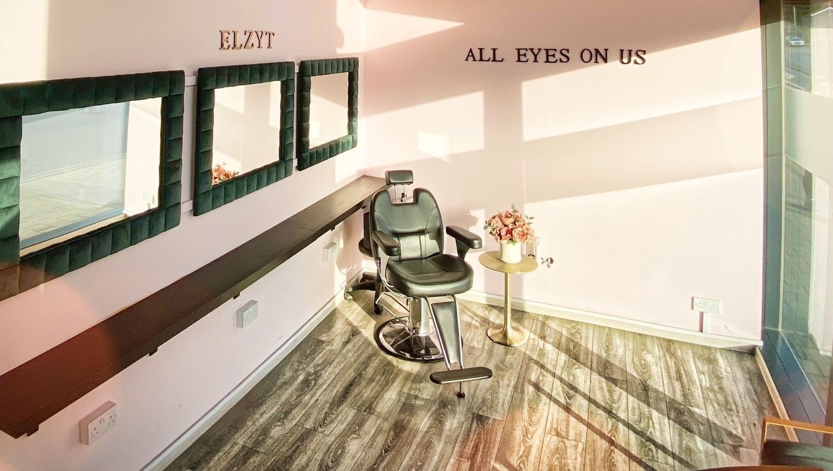 Elegant styling chair at Elzyt Brows by Patricija, Drogheda, County Louth, IE with mirrors and floral decor.