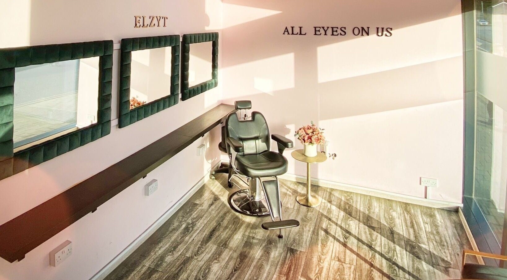 Elegant styling chair at Elzyt Brows by Patricija, Drogheda, County Louth, IE with mirrors and floral decor.