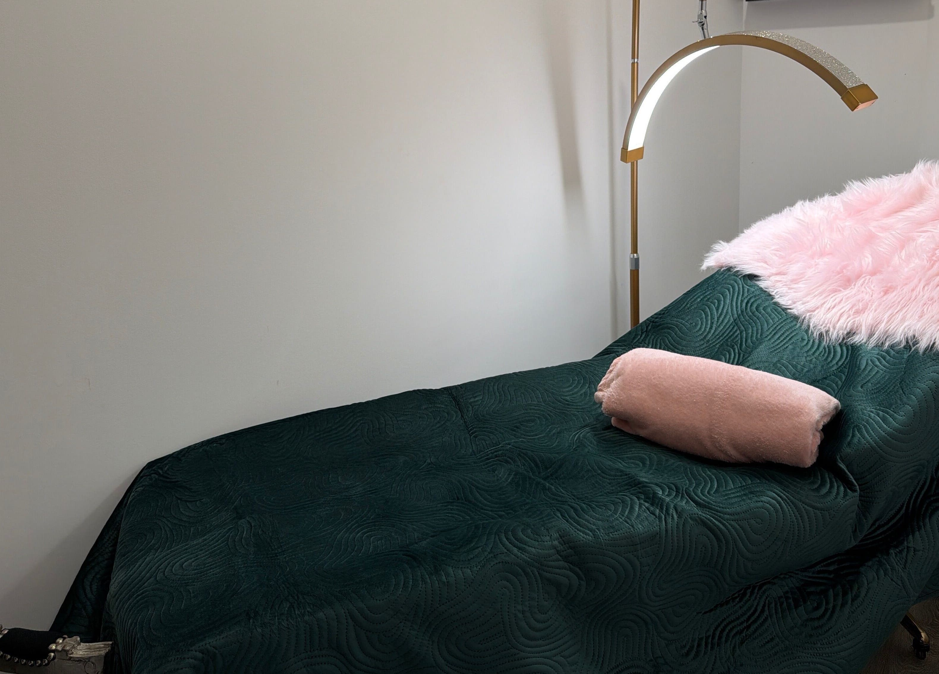 Luxurious treatment bed at Elzyt Brows by Patricija, Drogheda, County Louth, IE with soft pink accents.