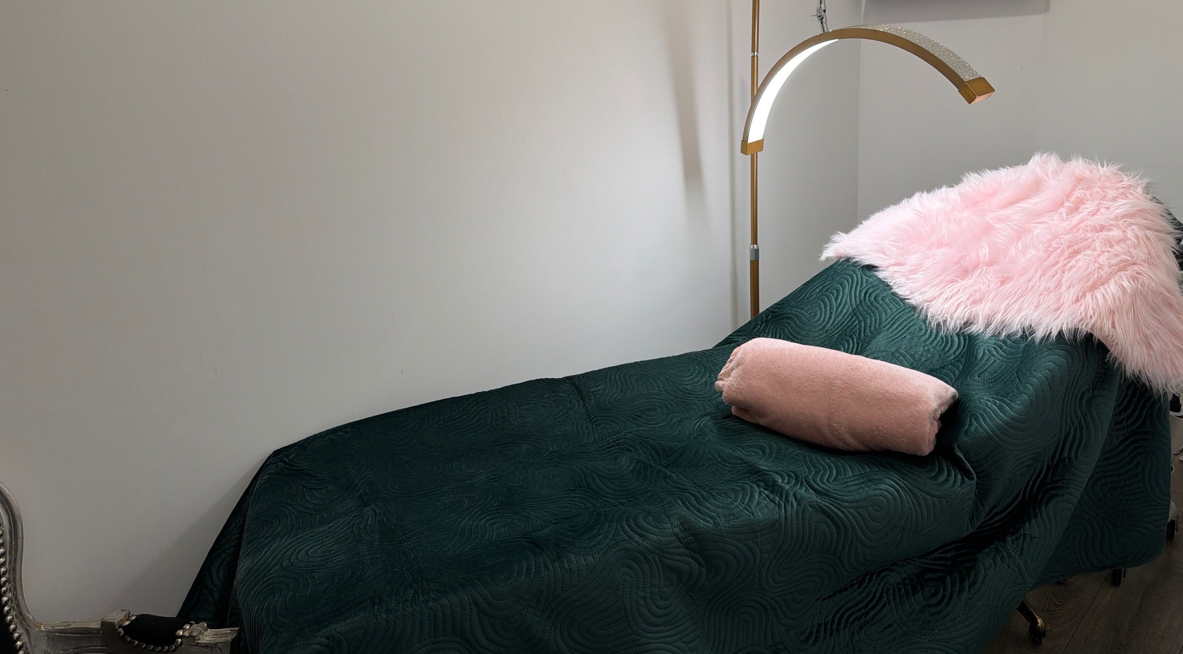 Luxurious treatment bed at Elzyt Brows by Patricija, Drogheda, County Louth, IE with soft pink accents.