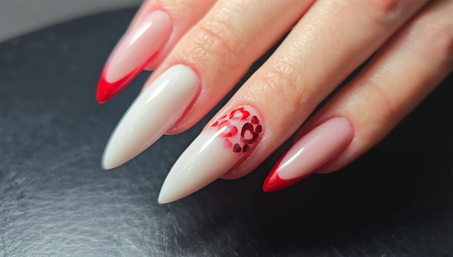 Heart-patterned red and white nails at Nataliia Demi Nails, London, England, GB.