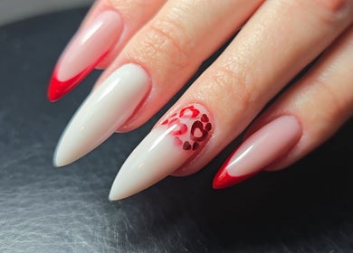 Heart-patterned red and white nails at Nataliia Demi Nails, London, England, GB.