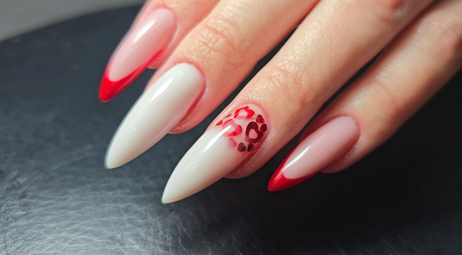 Heart-patterned red and white nails at Nataliia Demi Nails, London, England, GB.