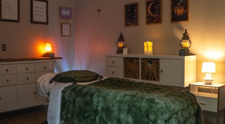 Relaxing therapy room at Youthful Glow Aesthetics in Munford, Tennessee, US, with warm lighting and soft decor.