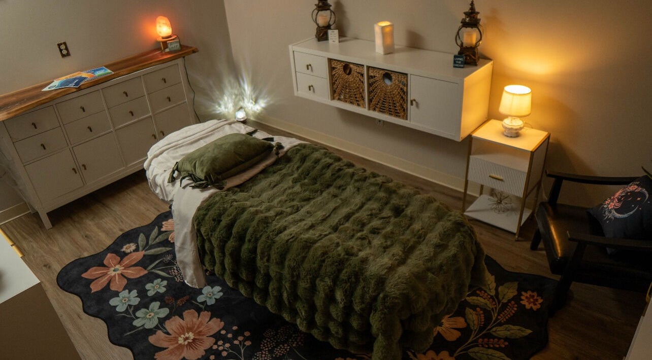 Cozy treatment room at Youthful Glow Aesthetics in Munford, Tennessee, US, featuring soft lighting and decor.