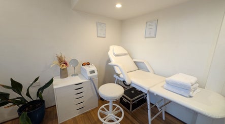 Relaxing treatment room at Laser by Tom, Bondi Junction, New South Wales, AU, featuring a comfortable chair.