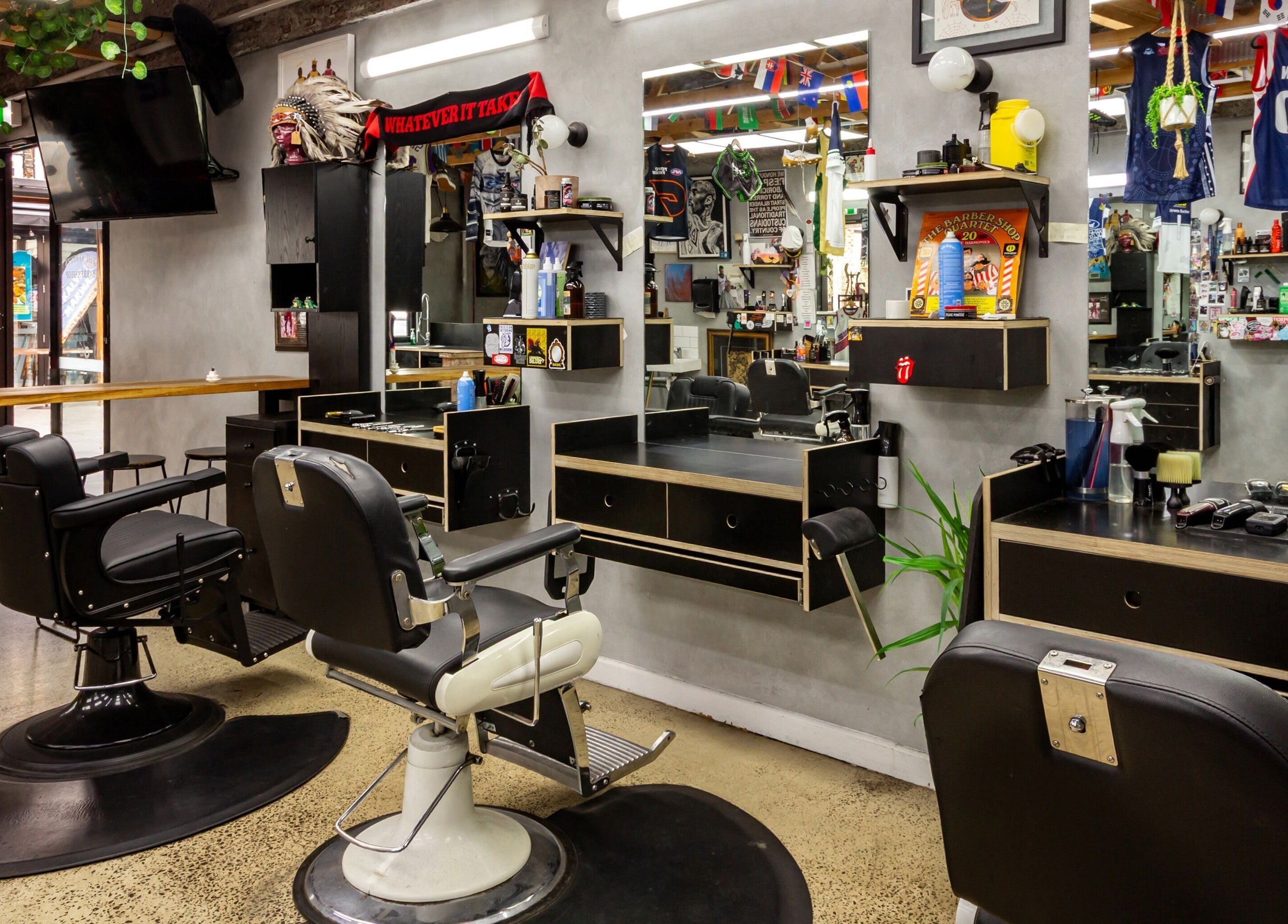 Chic interior of The Streets Barbershop in Geelong West, Victoria, AU featuring vintage barber chairs and decor.