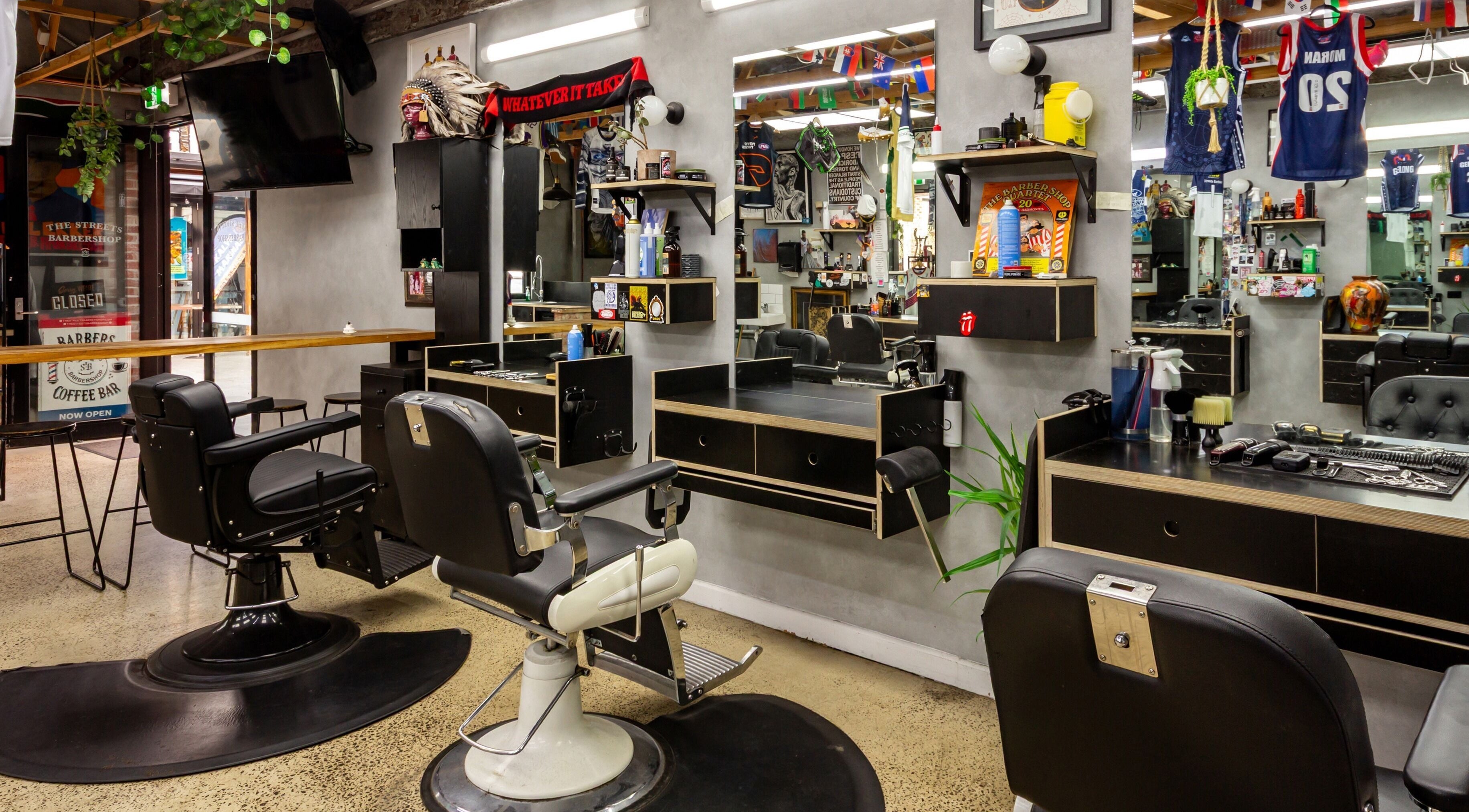 Chic interior of The Streets Barbershop in Geelong West, Victoria, AU featuring vintage barber chairs and decor.