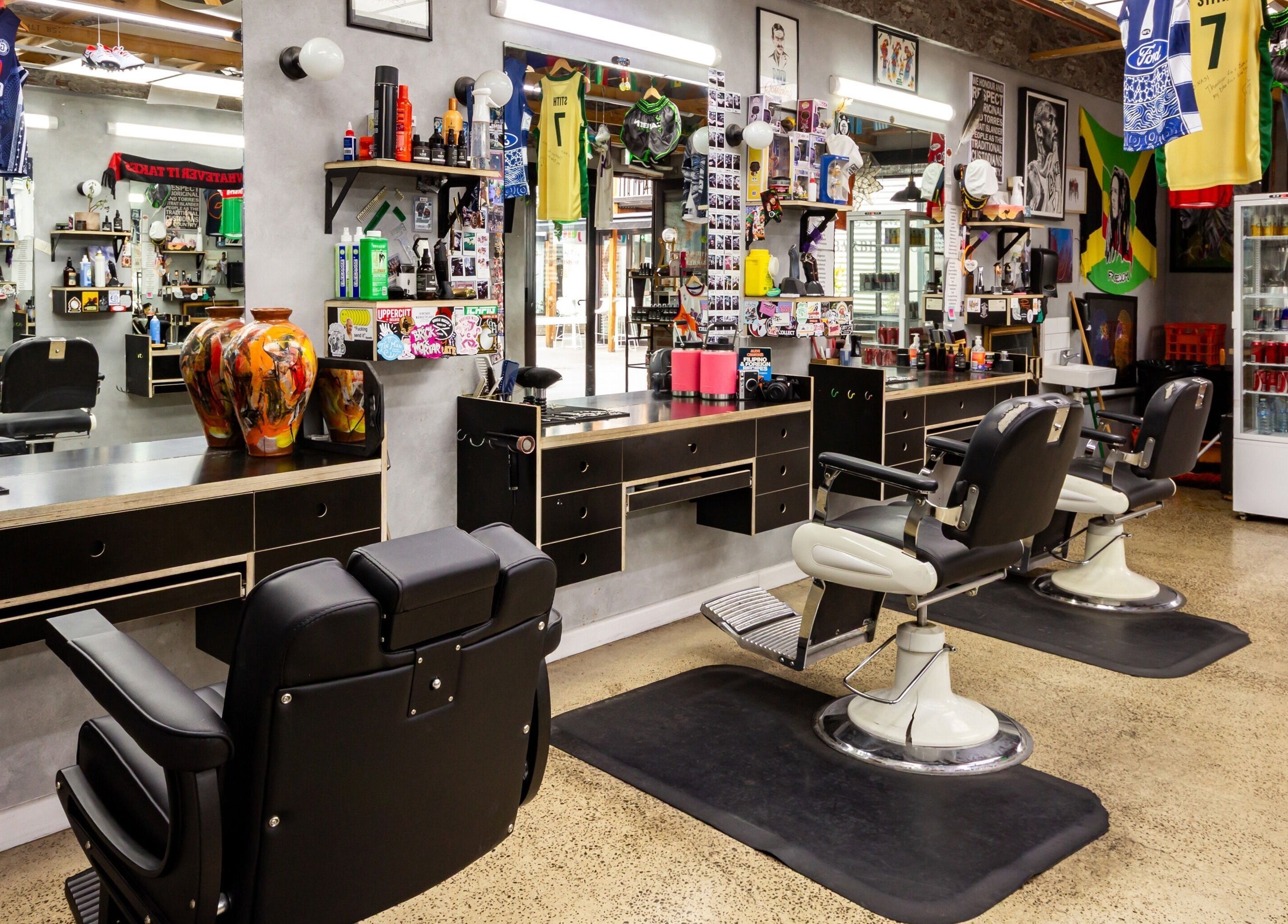 Stylish interior of The Streets Barbershop in Geelong West, Victoria, AU, featuring modern barber chairs and decor.