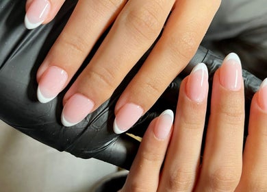 French manicure at Strand Salon, Riyadh, Riyadh Province, SA, showcasing elegant nail art.