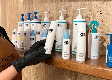 K18 haircare products elegantly displayed at Strand Salon, Riyadh, Riyadh Province, SA.