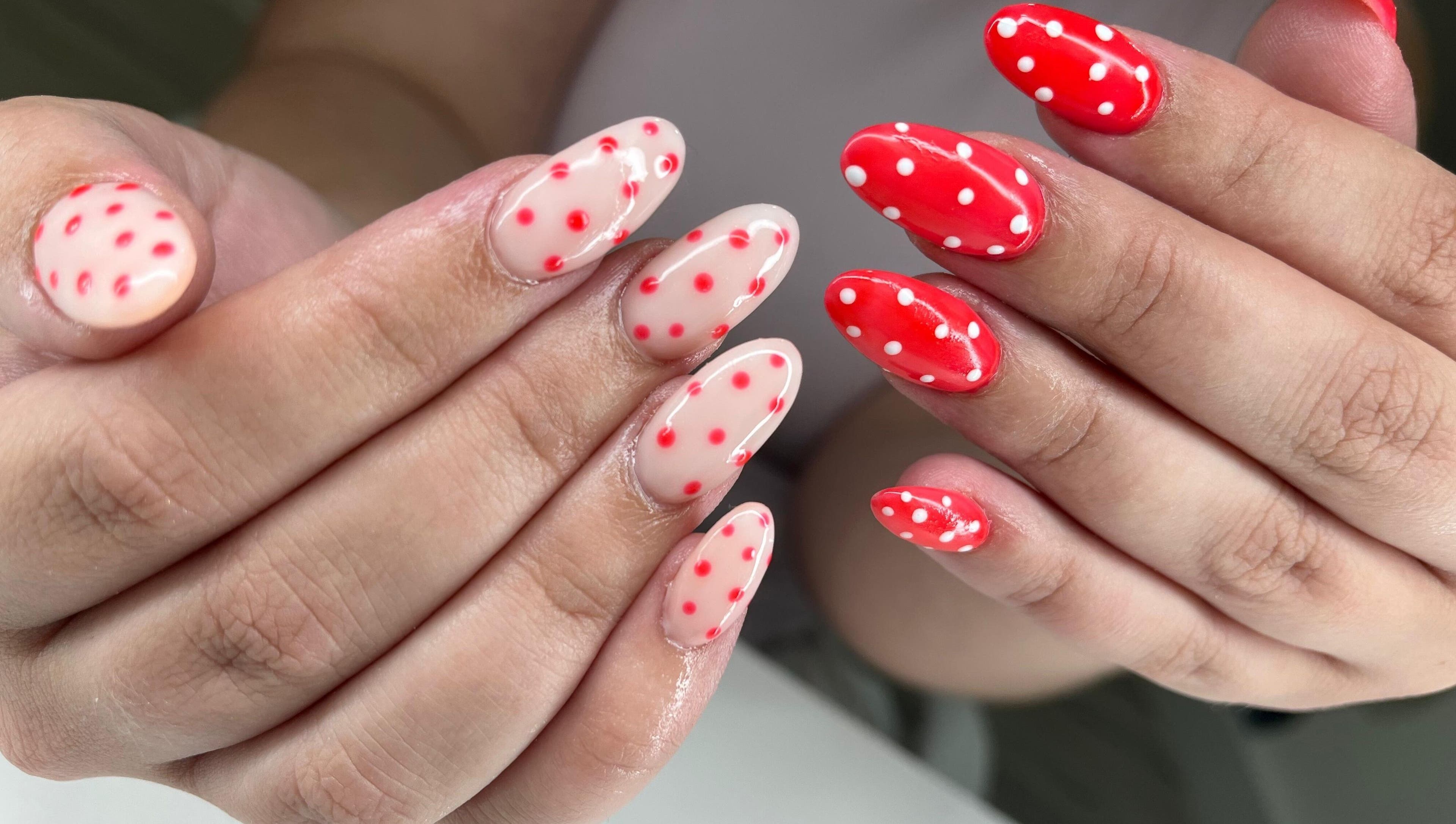 Polka dot nail art at Glow Gang Studio in Cape Town, Western Cape, ZA showcases vibrant red and white designs.