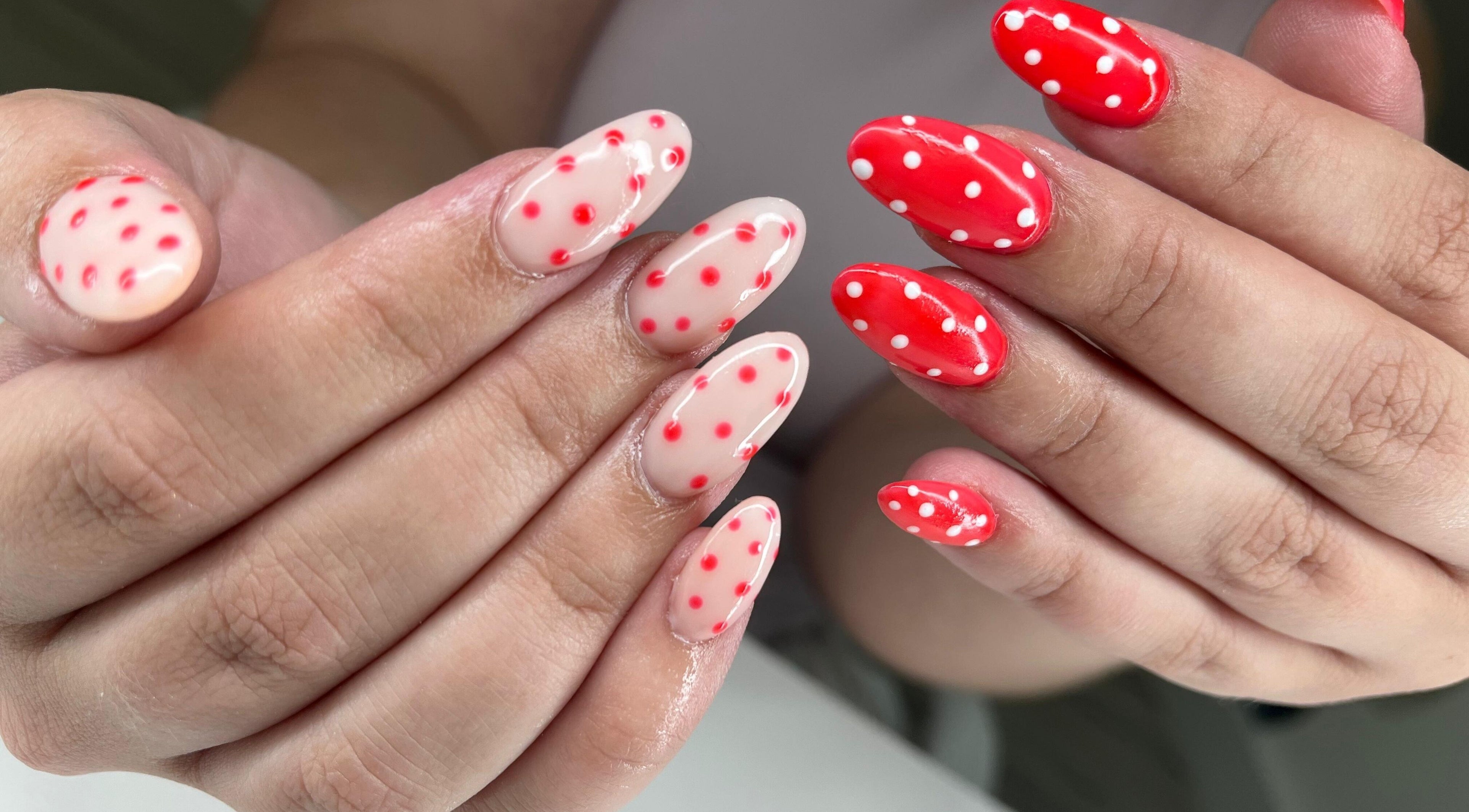 Polka dot nail art at Glow Gang Studio in Cape Town, Western Cape, ZA showcases vibrant red and white designs.