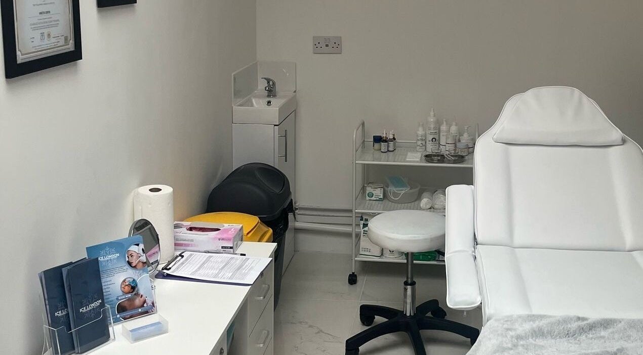 Elegant treatment room at Ice London Aesthetics Clinic, Beckenham, England, GB with white chair and equipment.