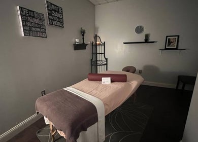 Peaceful massage room at Tropical Touch Akron in Akron, Ohio, US featuring a neatly arranged massage table.
