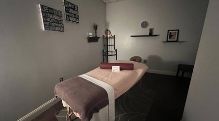Peaceful massage room at Tropical Touch Akron in Akron, Ohio, US featuring a neatly arranged massage table.