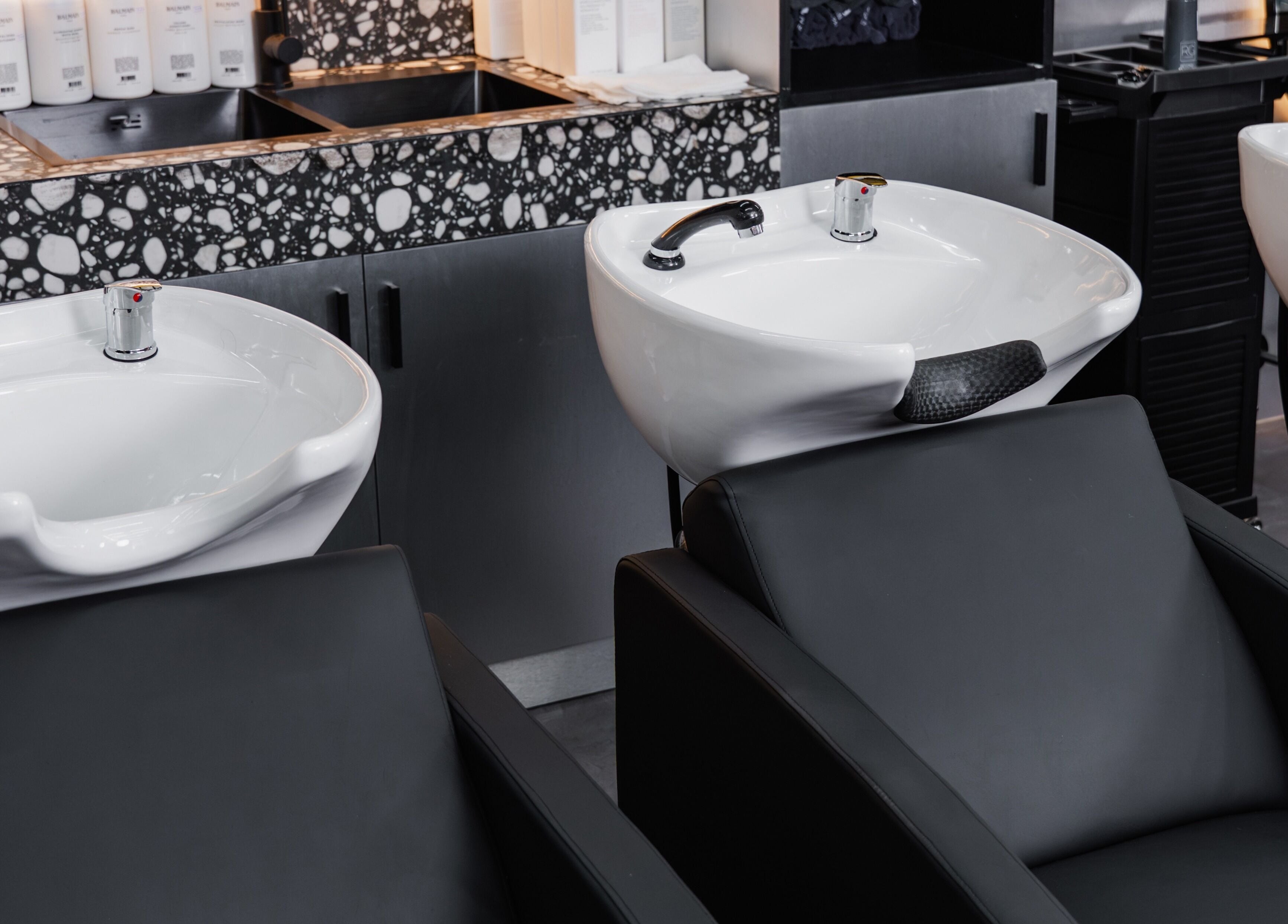 Modern washbasin setup at Elated, a premium salon in Abu Dhabi, AE, designed for comfort and elegance.