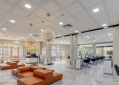 Spacious and modern interior of Tandi's Curls, Kellyville Ridge, New South Wales, AU with elegant salon chairs.