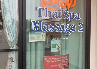 Front window of Thaispa Massage 2, located in Las Vegas, Nevada, US, displaying open sign and services offered.