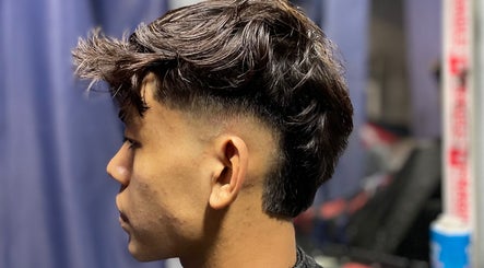Trendy haircut for men at Aisy’s Cut, Gombak, Selangor, MY showcasing tapered sides and textured top.