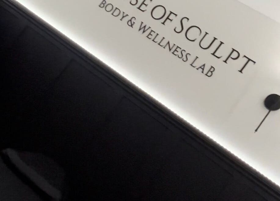 Stylish interior of House Of Sculpt in Featherstone, England, GB with modern wall light and elegant decor.