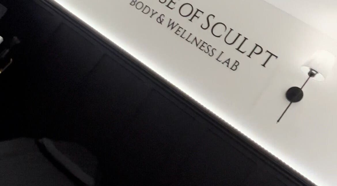 Stylish interior of House Of Sculpt in Featherstone, England, GB with modern wall light and elegant decor.