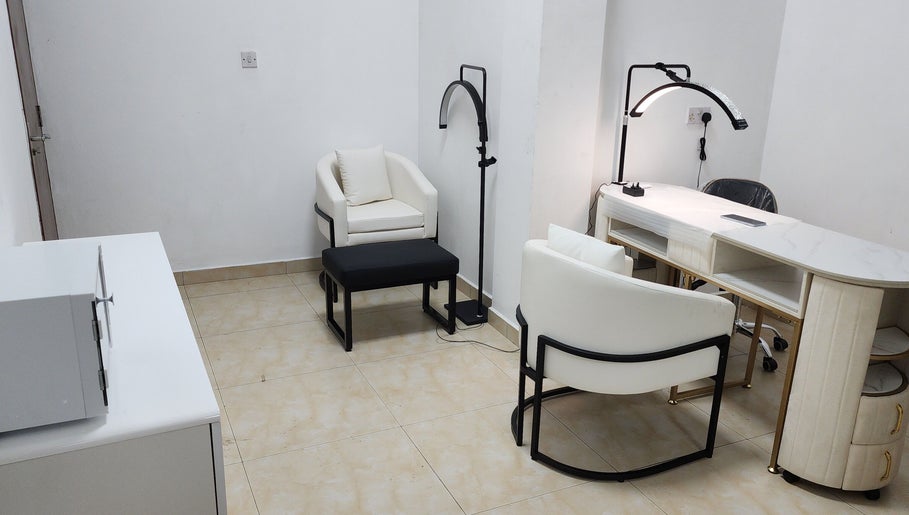 Elegant salon setup at Posh Nail Lounge, Grand Anse, Grand Anse Praslin, SC with modern chairs and manicure table.