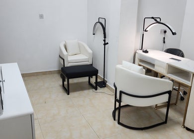 Elegant salon setup at Posh Nail Lounge, Grand Anse, Grand Anse Praslin, SC with modern chairs and manicure table.