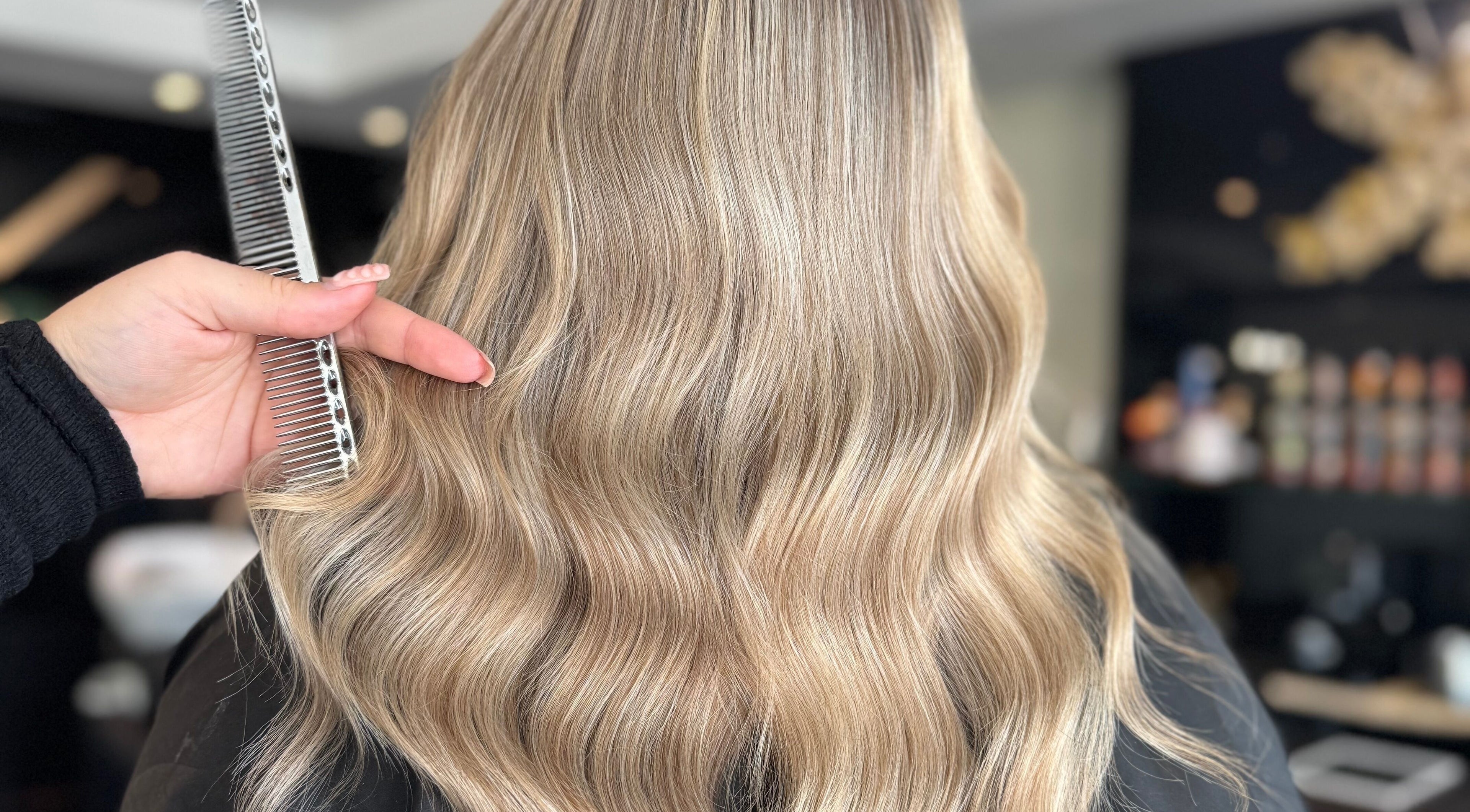 Styled blonde waves at Jesslewishair, Kirkby In Ashfield, England, GB showcasing expert hair techniques.