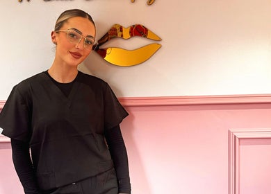 Beauty professional at Mirabellabymegan, Newcastle-under-lyme, England, GB, in chic salon setting.