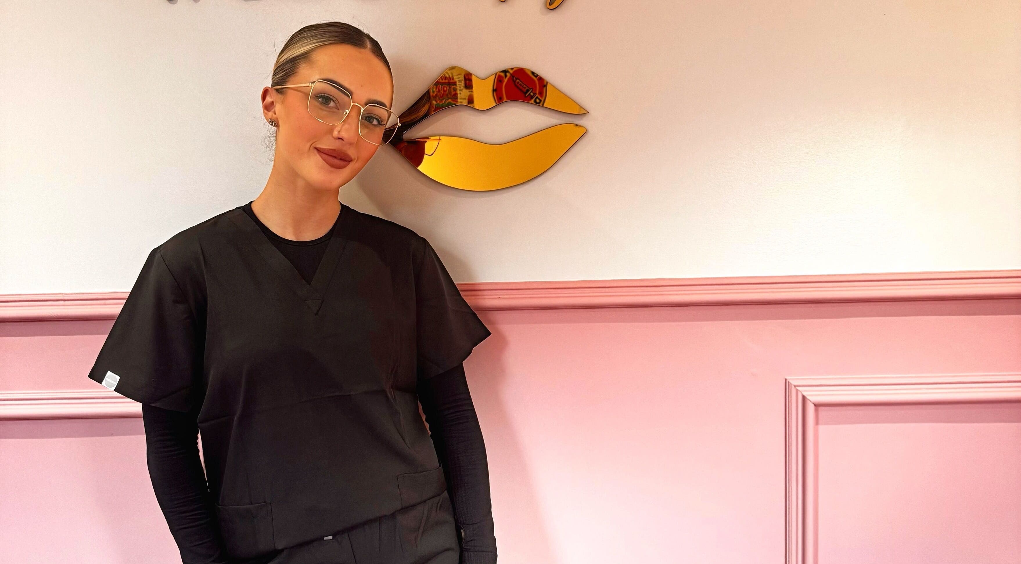 Beauty professional at Mirabellabymegan, Newcastle-under-lyme, England, GB, in chic salon setting.