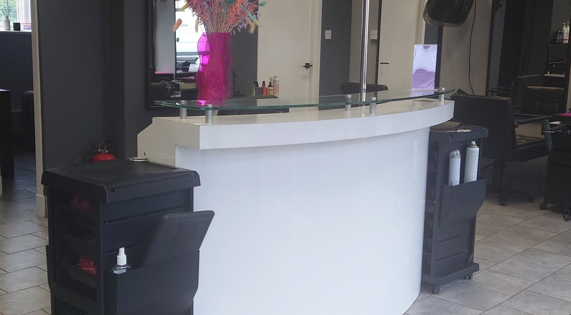 Reception area at Leigh Slattery Hair in Johnstone, Scotland, GB, showcasing stylish modern design.